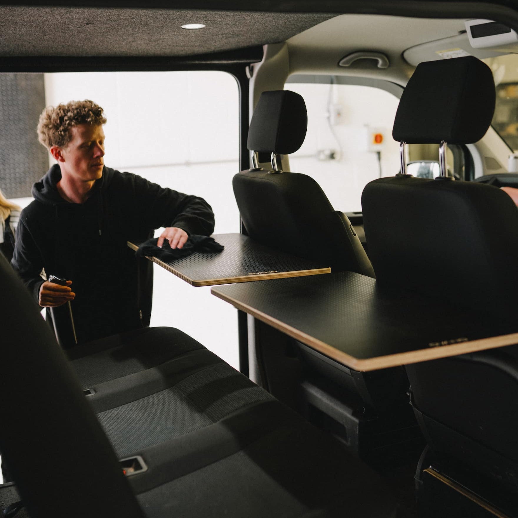 2 x ovano tables shown side by side installed in a VW Transporter.
