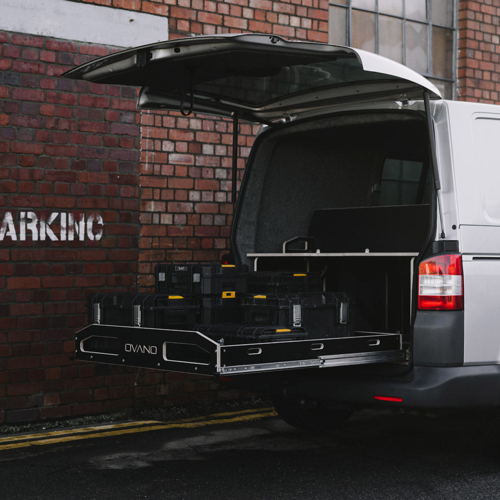 Commercial T5.1 with an extended cargo area against a brick wall. Loaded with Dewalt Tough System tool boxes.