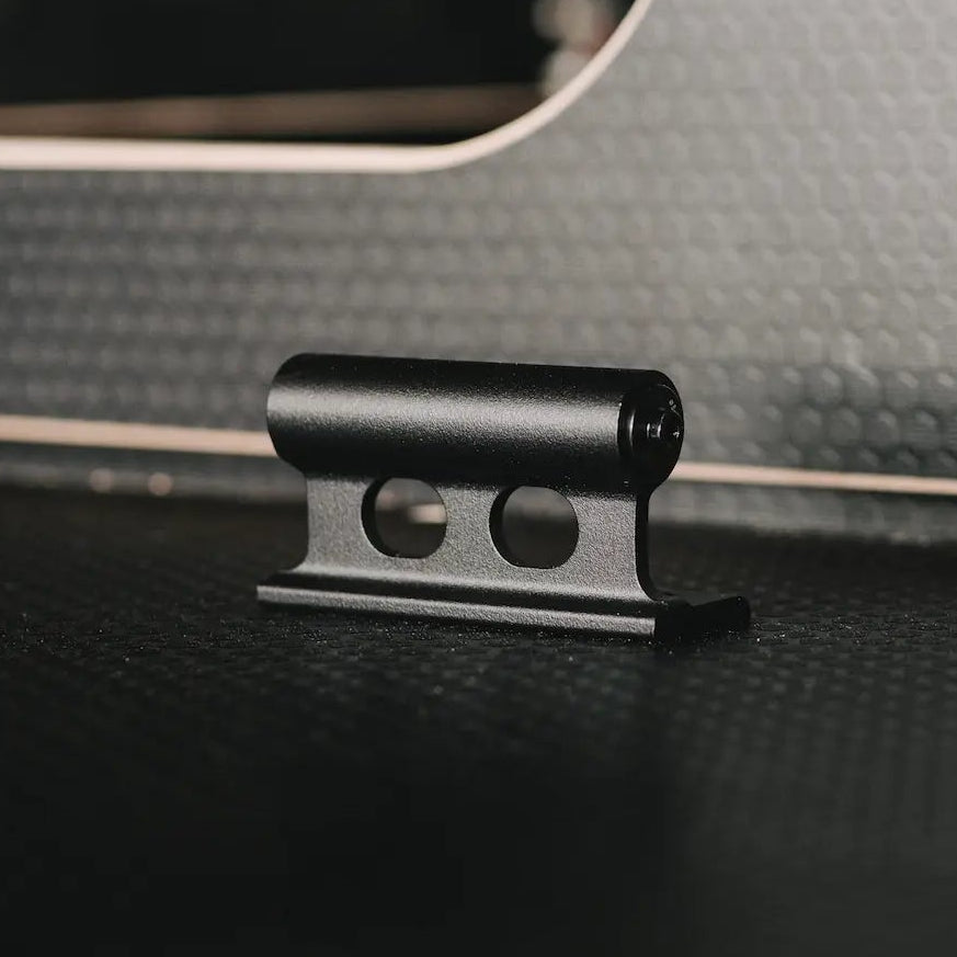 Close-up of a fork mount handle on a surface with a blurred interior background