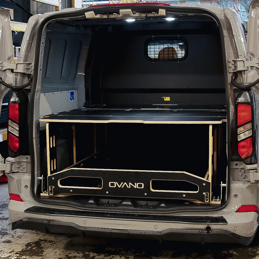 Back of a Transit Custom with an open cargo area featuring an Ovano dualdeck product.