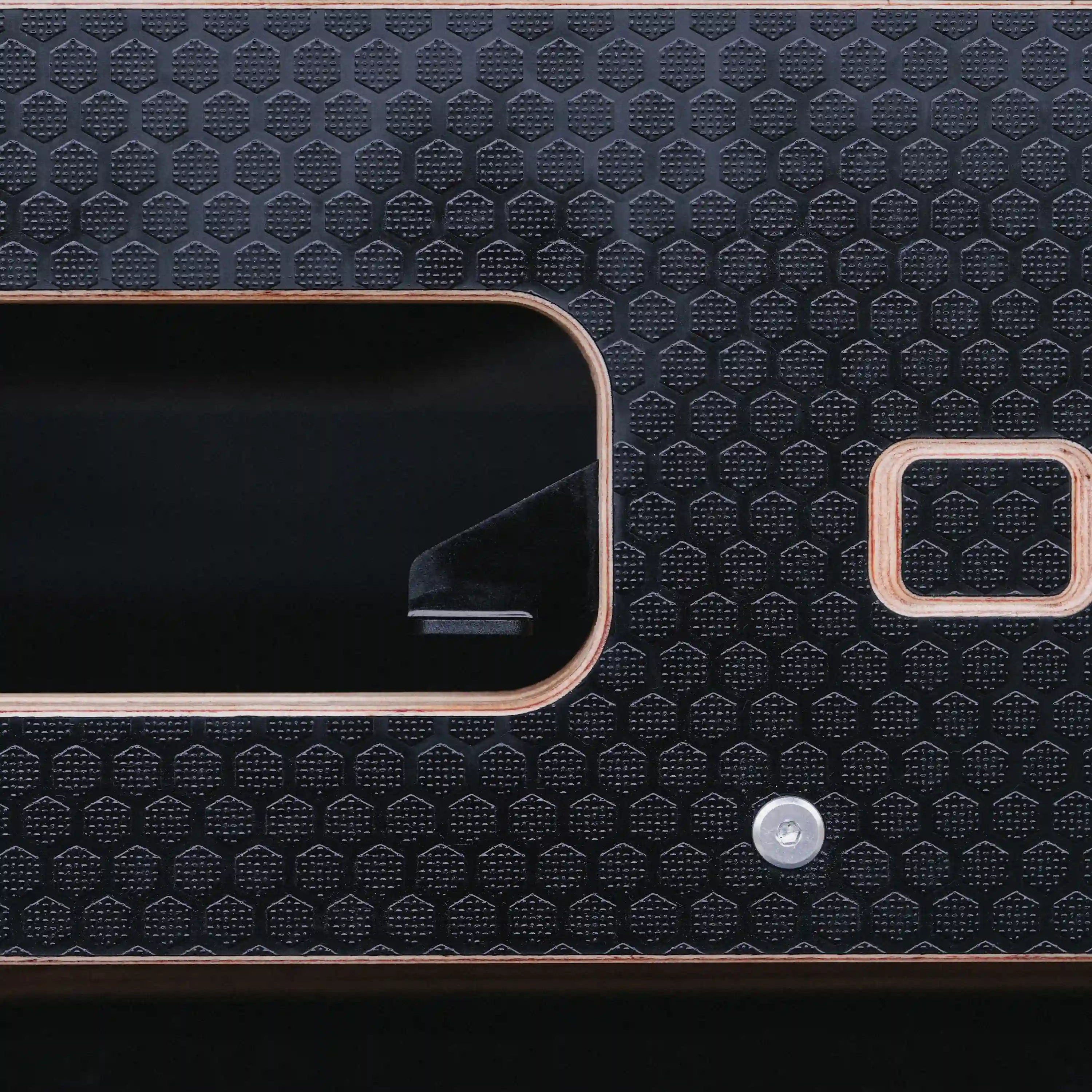 close-up of one touch mechanism on a black Ovano drawer front