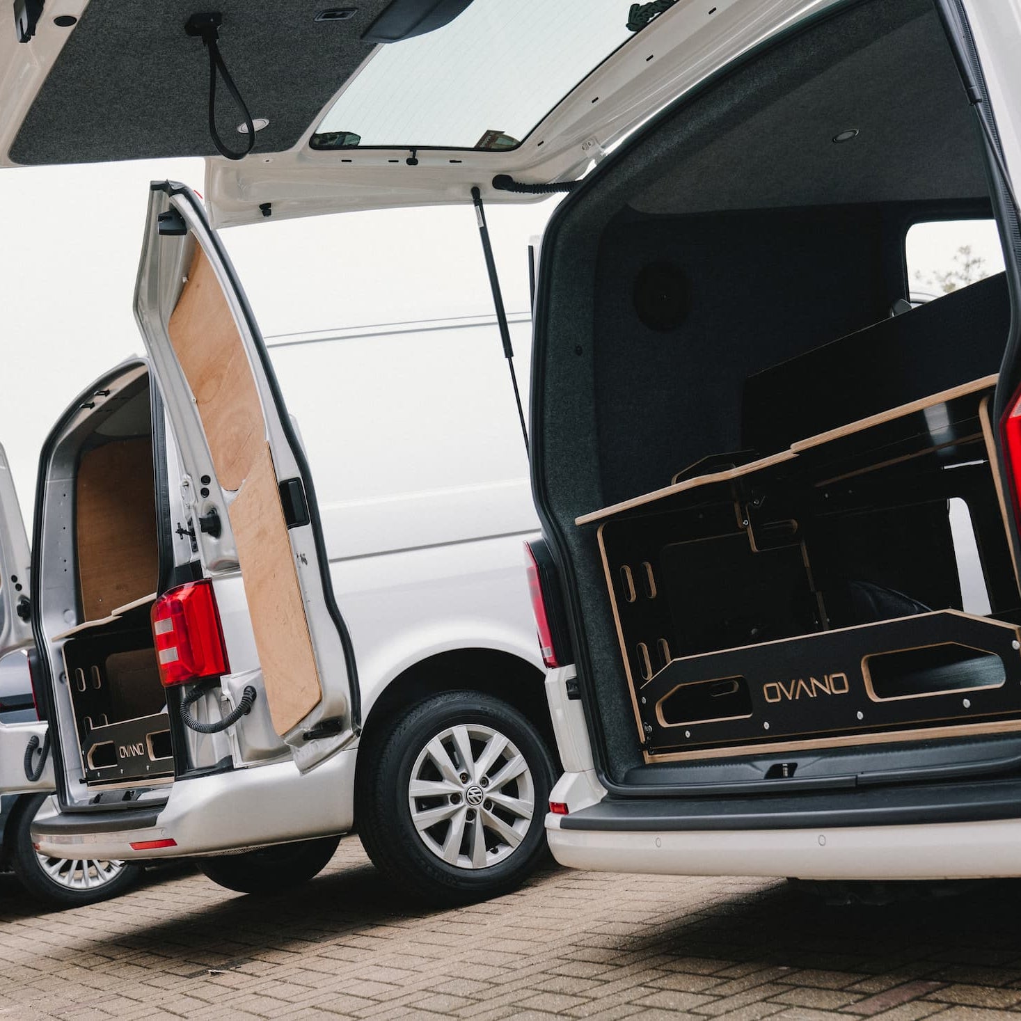 2 x vans, one has a tailgate and one had barn doors both with ovano units