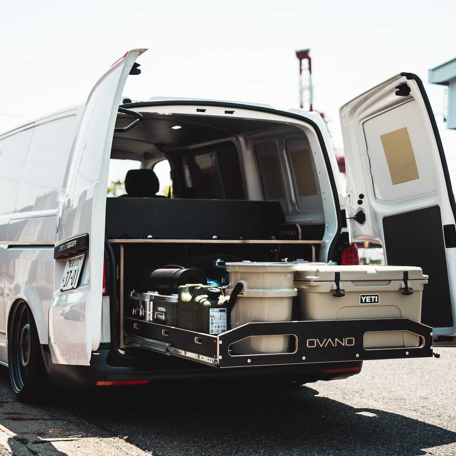 Van in Japan with rear barn doors open and ovano drawer system pulled out