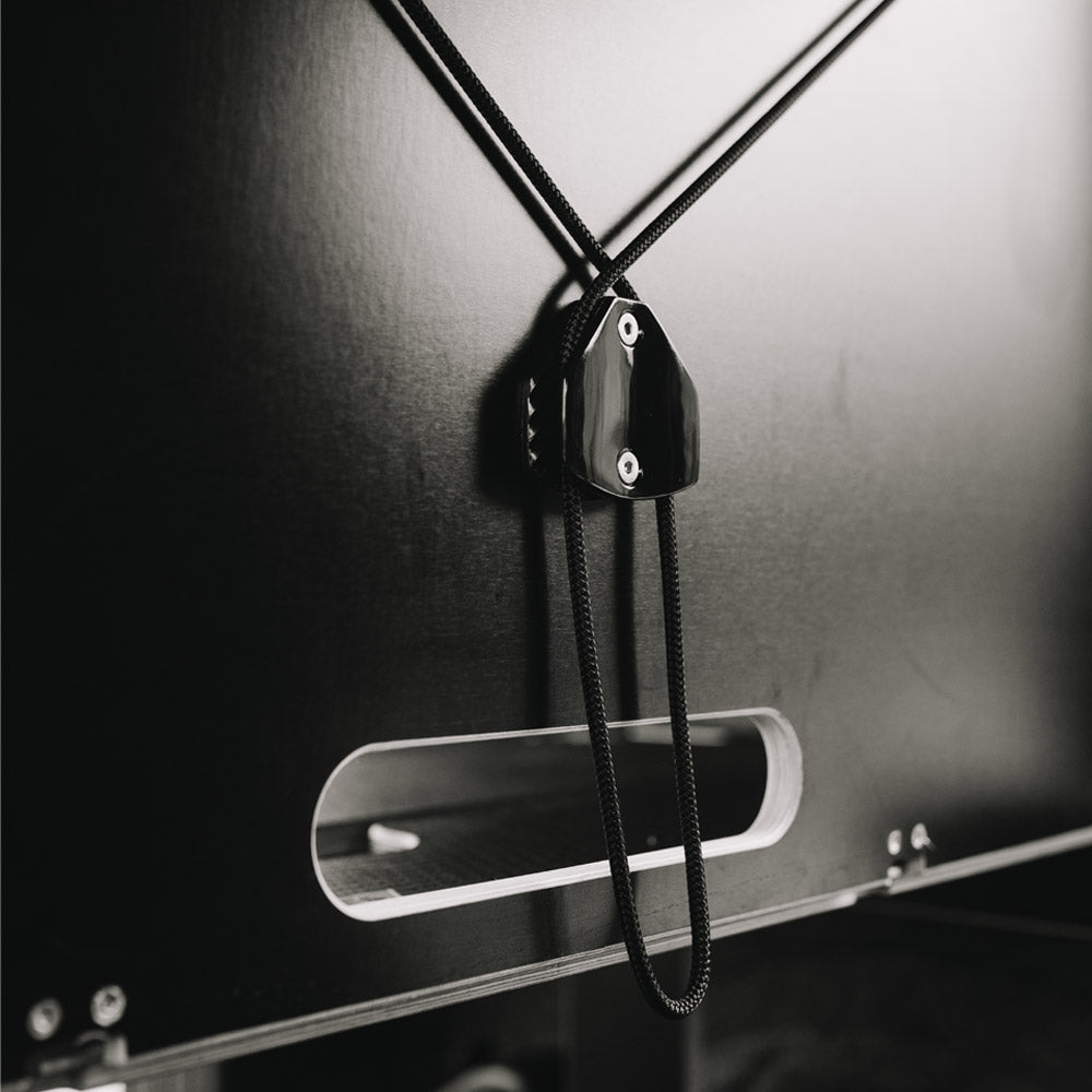 Close up of rear of Ovano Switch XL bulkhead, showing a silk black finish with an injection moulded sailing fitting and black line.