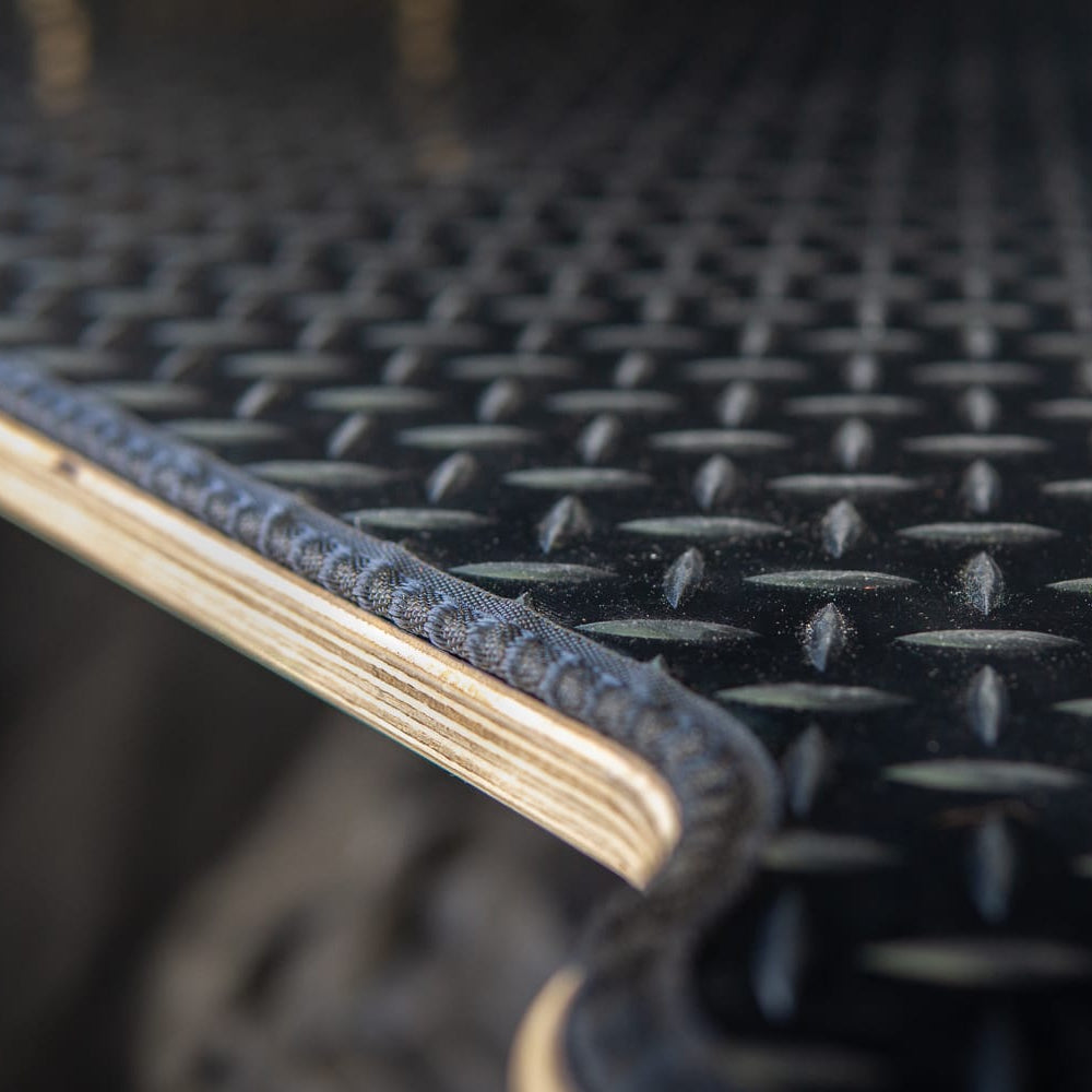 Black chequer plate rubber mat on an ovano bed unit