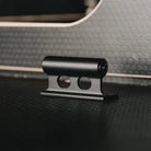 Close-up of a fork mount handle on a surface with a blurred interior background