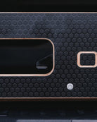 close-up of one touch mechanism on a black Ovano drawer front