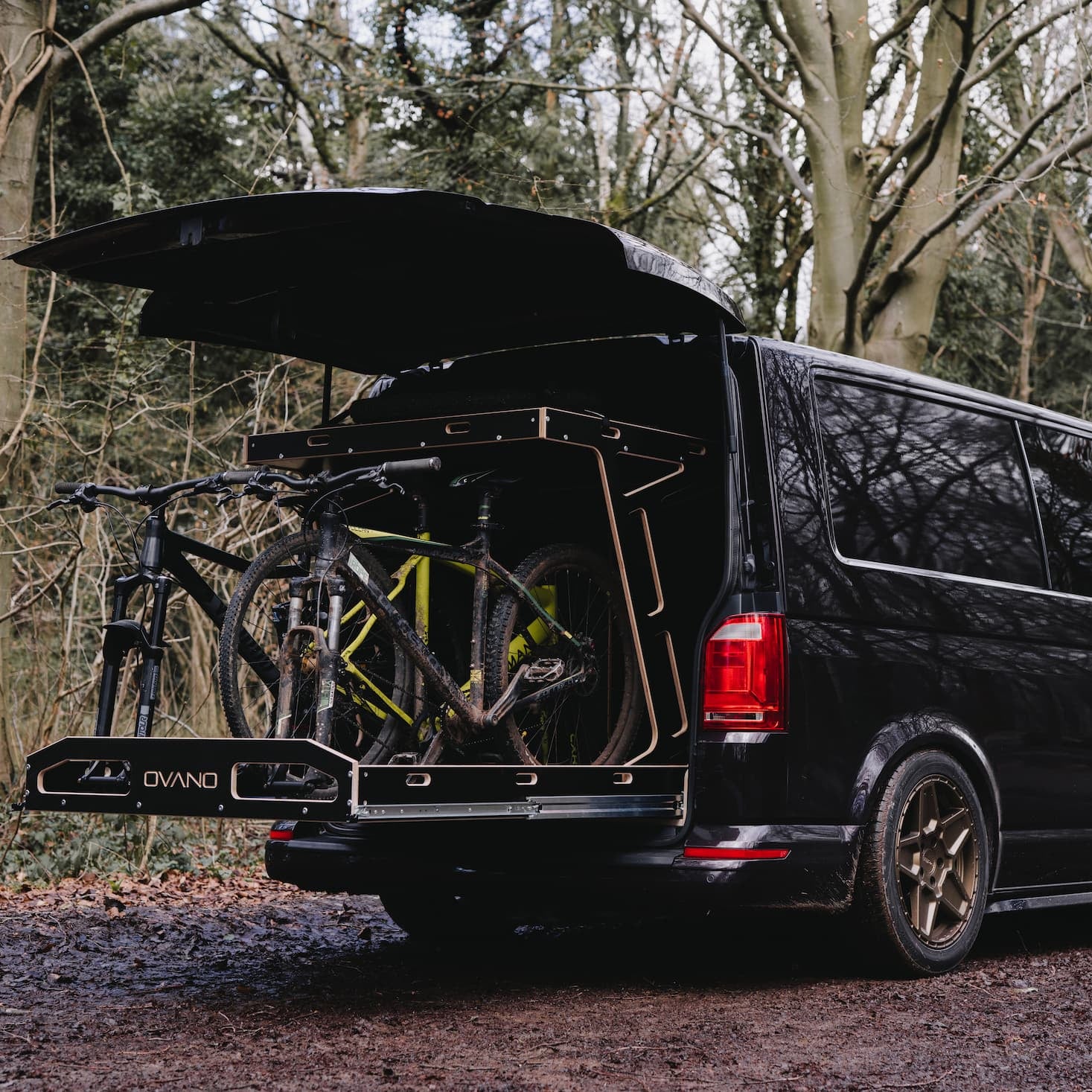 LWB Kombi carrying 3x MTB in a sliding bike tray.