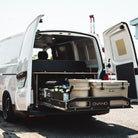 Van in Japan with rear barn doors open and ovano drawer system pulled out