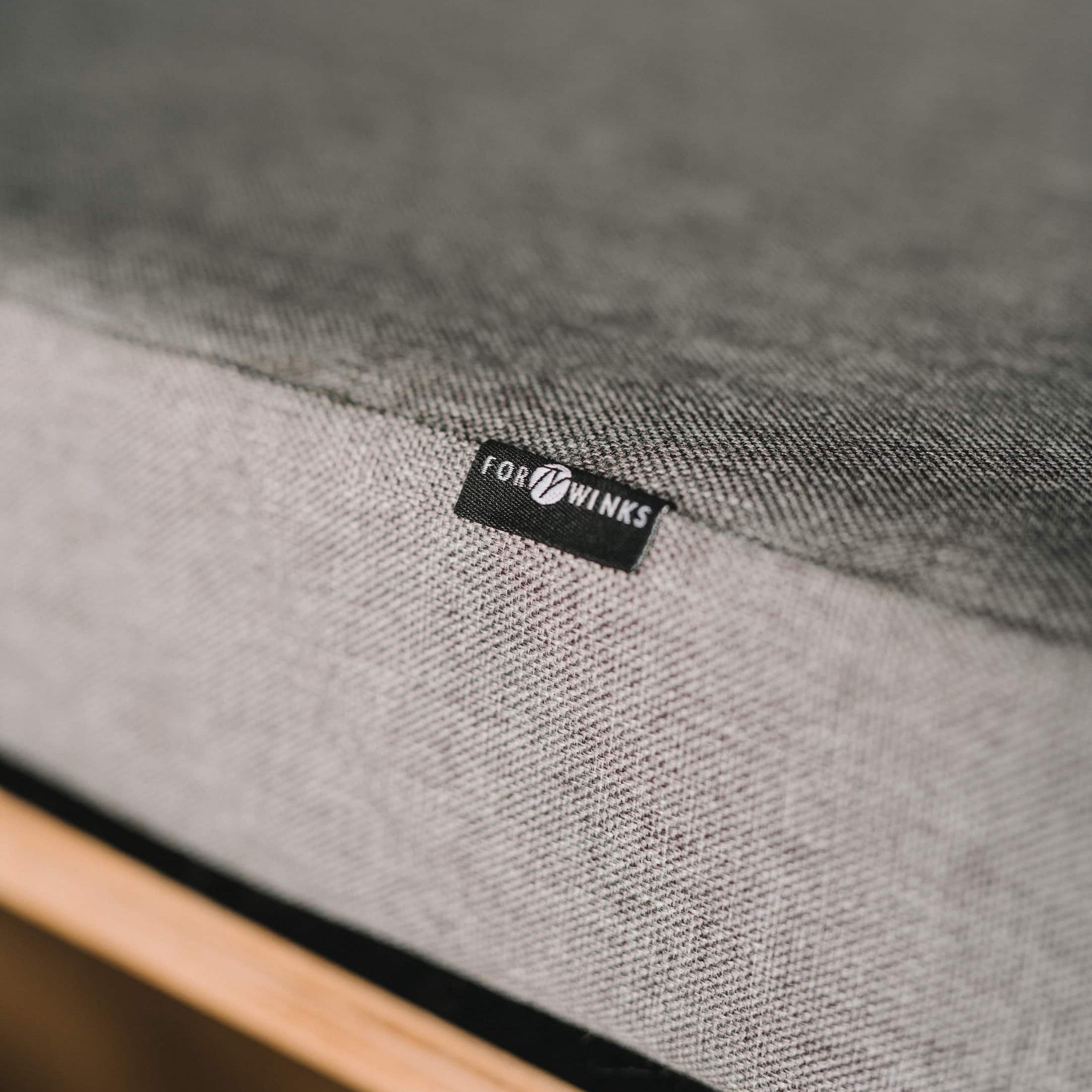 close-up of a fortywinks premium mattress with a grey cotton cover