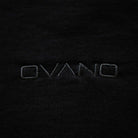 Close-up of 'OVANO' logo on a black background