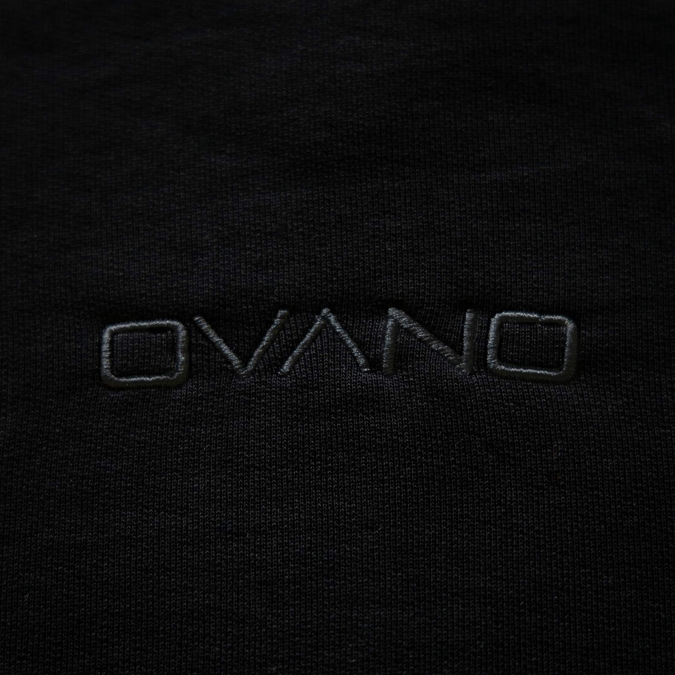 Close-up of 'OVANO' logo on a black background