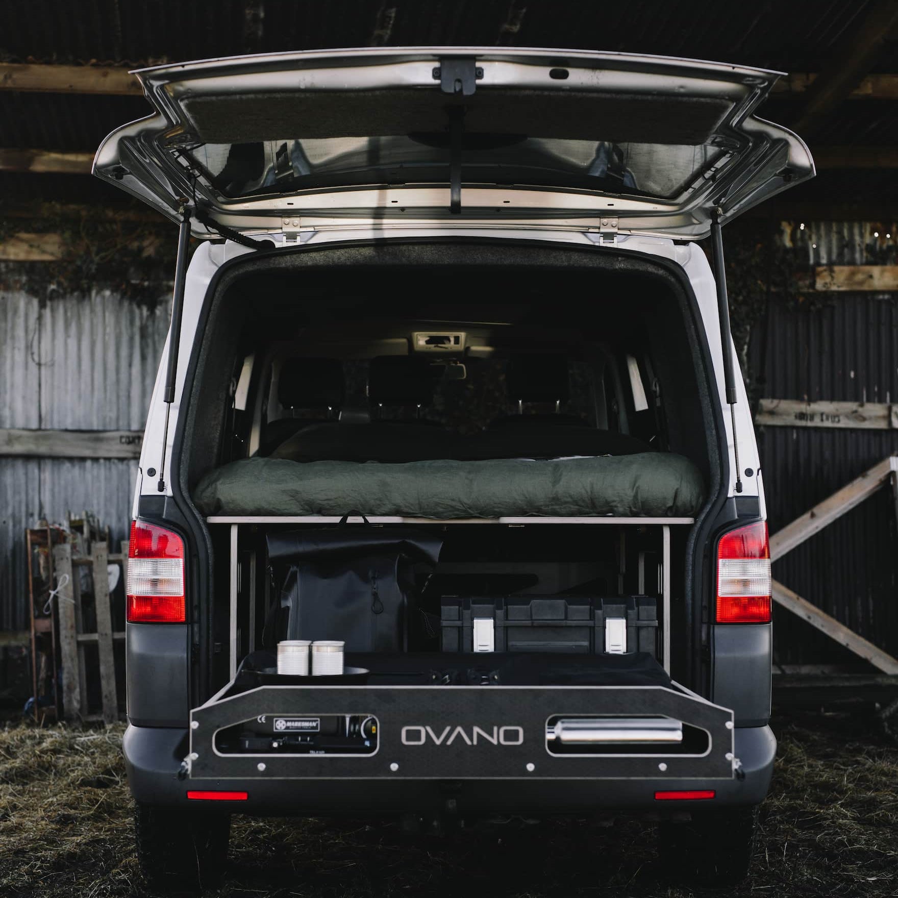 Ovano switch xl bed bulkhead and drawer system in a T5.1 parked in a barn