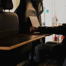 Two Ovano B-pillar tables shown installed side by side in Transit Crew-cab