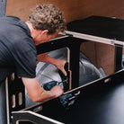 ovano side support being installed on switch xl panel van drawer unit