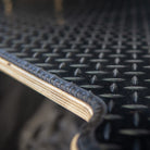 Black chequer plate rubber mat on an ovano bed unit